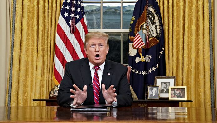 U.S. President Donald Trump speaks during an address on border security in the Oval Office of the White House in Washington, D.C. | Photographer: Carlos Barria | Pool via Bloomberg