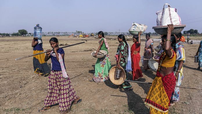 Workers carry equipment and supplies in Andhra Pradesh| Representational image | Dhiraj Singh/Bloomberg