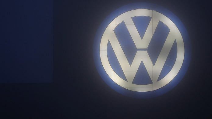 The Volkswagen AG logo | Krisztian Bocsi/Bloomberg