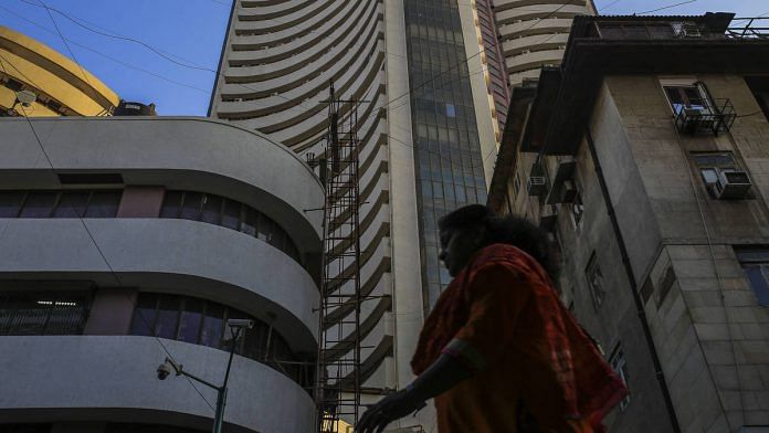 A pedestrian walks past the Bombay Stock Exchange (BSE) building in Mumbai