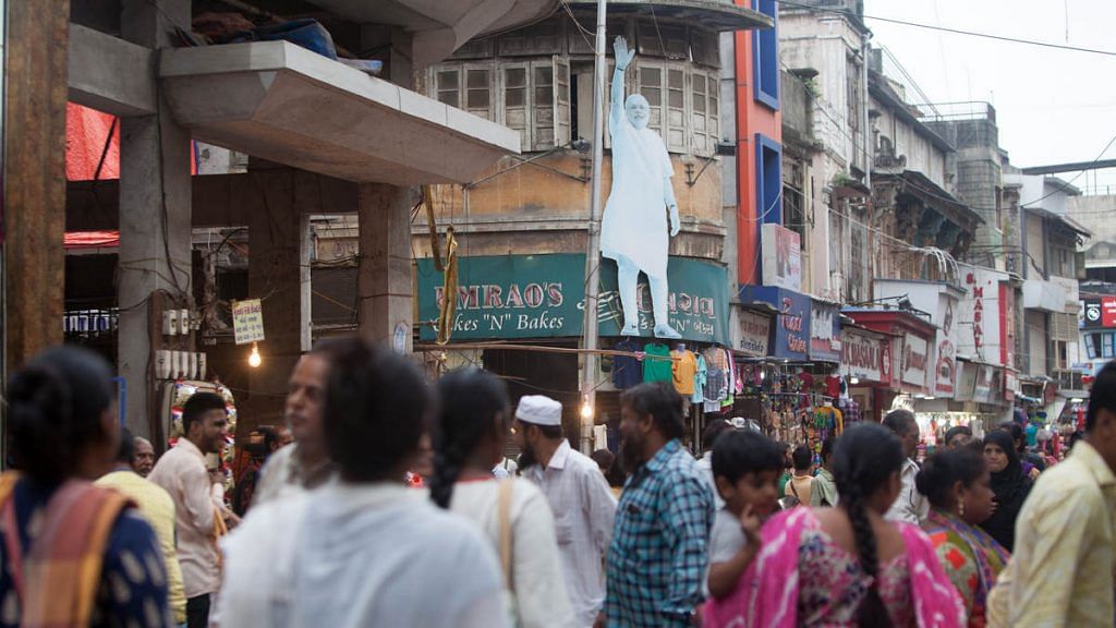 A cut-out of Indian Prime Minister Narendra Modi, center in the middle of a street in Surat (Representational image)
