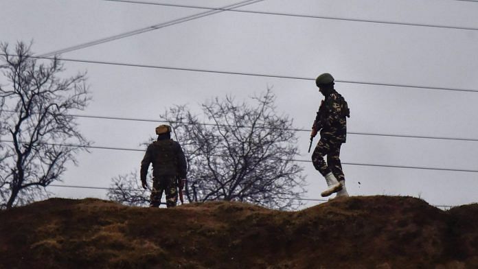 Army soldiers guard near the site of suicide bomb attack at Lathepora Awantipora in Pulwama