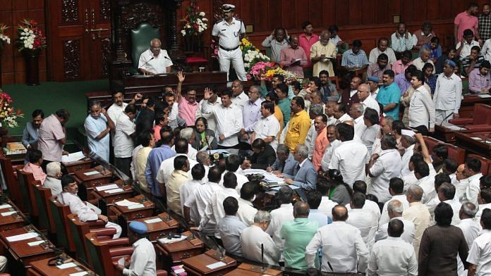 BJP legislators raise slogans on the second day of the Budget Session of Assembly at Vidhan Soudha, in Bengaluru | PTI