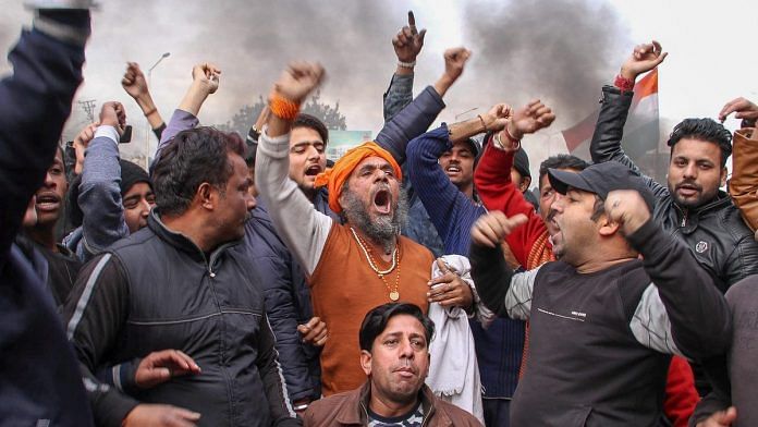 Protestors raise slogans during a demonstration against the Pulwama terror attack in Jammu
