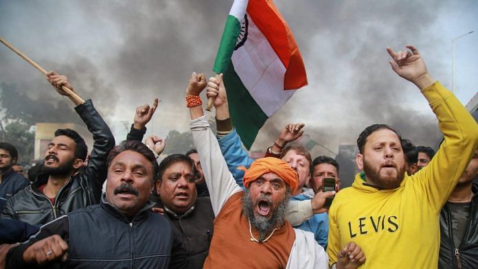 Protesters raise slogans during a demonstration against the Pulwama terror attack, in Jammu