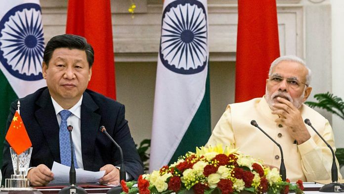Xi Jinping and Narendra Modi | Graham Crouch/Bloomberg