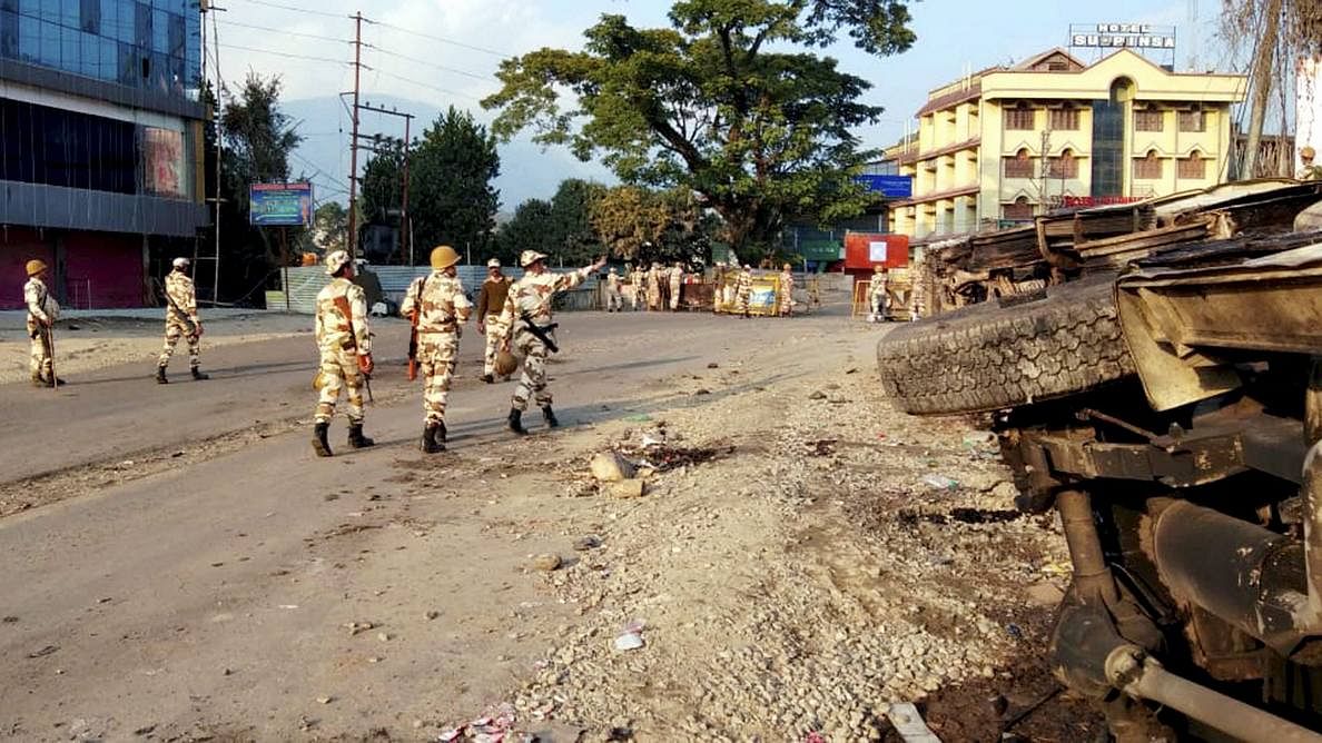 Security personnel patrol a street during restrictions, imposed after a mob went on a rampage during a protest against the move to grant permanent resident certificates to six communities living in the state in Itanagar