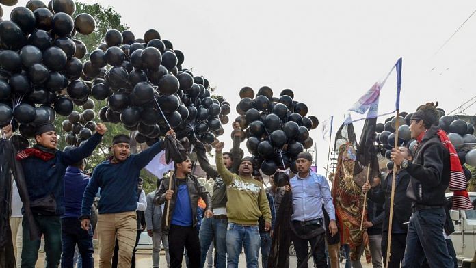 AASU memebrs display black ballons on Prime Minister Narendra Modi's arrival in Dibrugarh |PTI