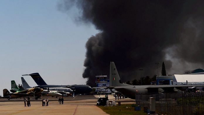 Smokes rises after a fire blew out near Bharati Nagar Gate's parking area at Aero India air show | Shailendra Bhojak/PTI