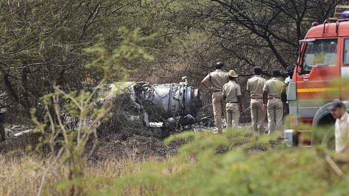 Police personnel stand near the wreckage of the Mirage-2000 fighter aircraft | Shailendra Bhojak/PTI
