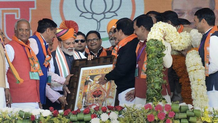 PM Narendra Modi receives a memento during a public rally in Churu, Rajasthan | PTI