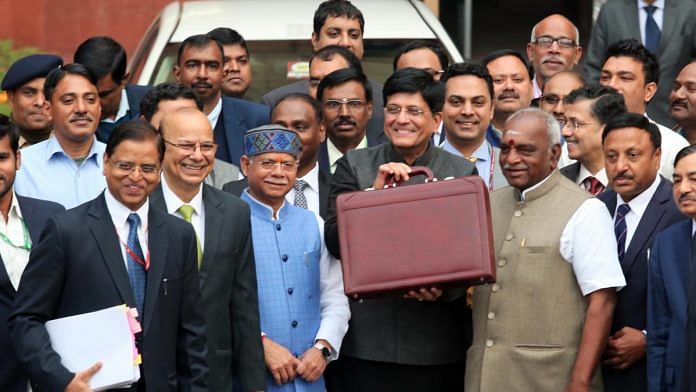 Finance minister Piyush Goyal holds up the briefcase which contains the interim budget presentation