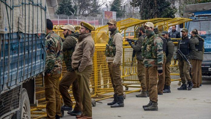 Police personnel stand guard in Srinagar following the Pulwama attack