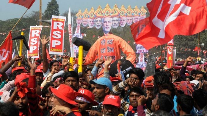 Left party activists carry an efigy of PM Modi as Ravana at Brigade ground in Kolkata | Ashok Nath Dey/ThePrint