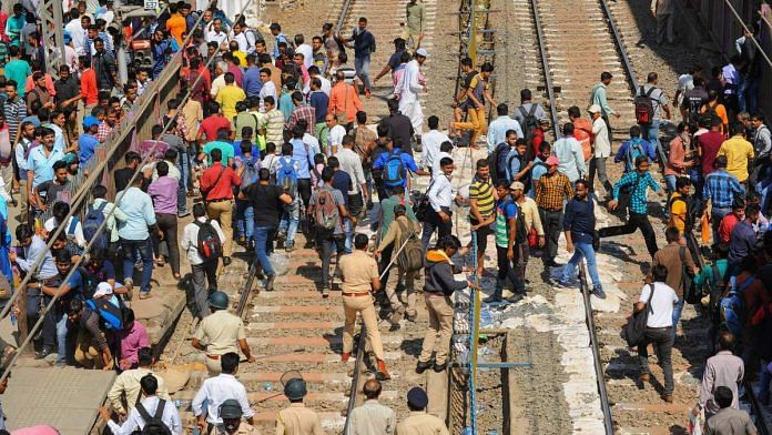 Protestors clash with police after they stopped a train at Nala Sopara during a protest over Pulwama terror attack at Palghar
