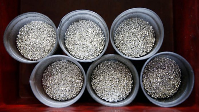 Silver casting grain sits in round holders during the refining process | Stefan Wermuth/Bloomberg