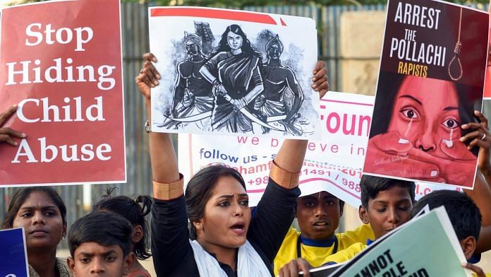Members of various Tamil organisations hold placards and raise slogans during a protest against the Pollachi rape case in Chennai