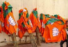 A worker carries Bharatiya Janata Party flags for distribution ahead of an election campaign (representational image) | PTI