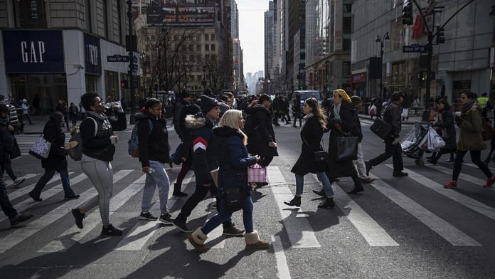 Pedestrians cross the street in New York | Victor J. Blue/Bloomberg