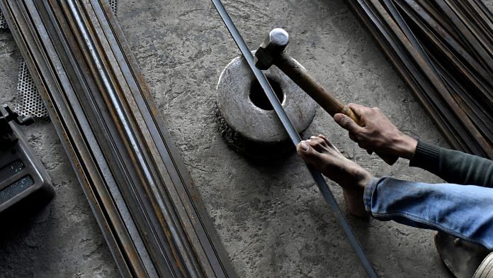 A worker hammers an iron rod at a workshop in Ahmedabad (representational image) | Anindito Mukherjee/Bloomberg