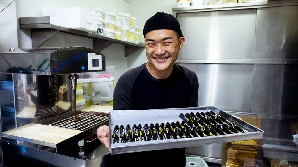 Ong Ning Geng of Chocolate Concierge presents a tray of chocolate | Nadirah Zakariya/Bloomberg