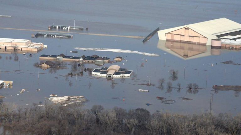 Strategic US air force base lies under water as arctic weather gives way to flooding