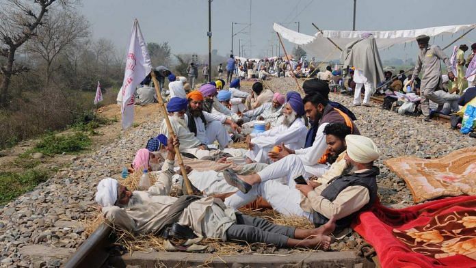 Farmers block railway tracks during a protest organised under the banner of Kisan Mazdoor Sangharsh Committee (KMSC) against the alleged anti-farmer policies of Punjab government