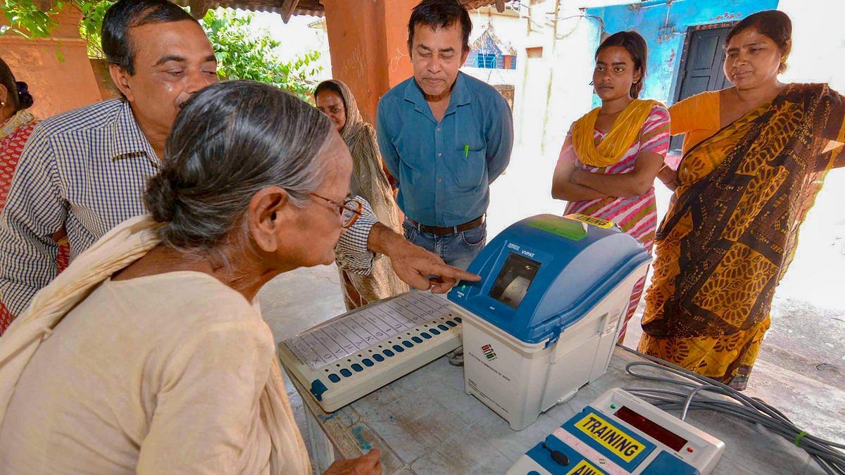 Election officials demonstrate the functioning of EVM and VVPAT for the local voters | PTI