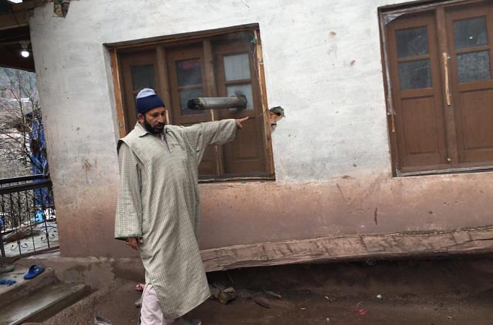 Farooq Ahmad, a Balkote resident points at cracks on his walls caused due to shelling | Moushumi Das Guota/ThePrint