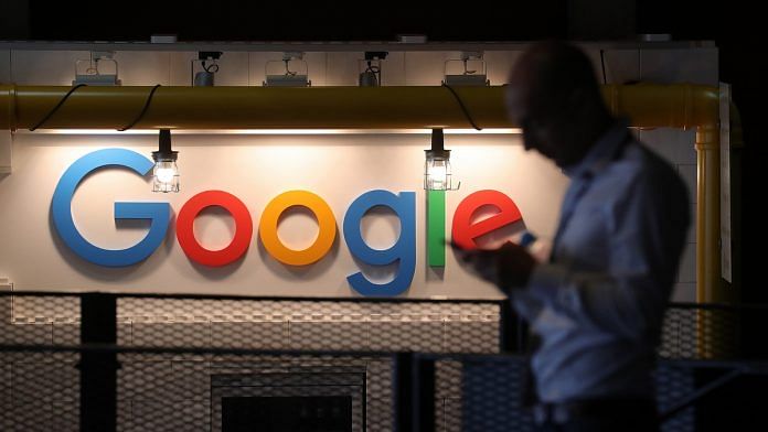The Google Inc. logo sits illuminated on the company's exhibition stand at the Noah Technology Conference in Berlin
