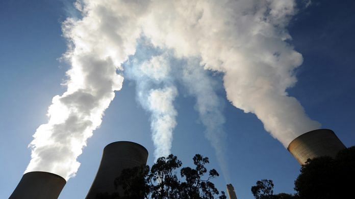 Steam billows from the cooling towers of the Yallourn coal-fired power station operated by EnergyAustralia Holdings Ltd