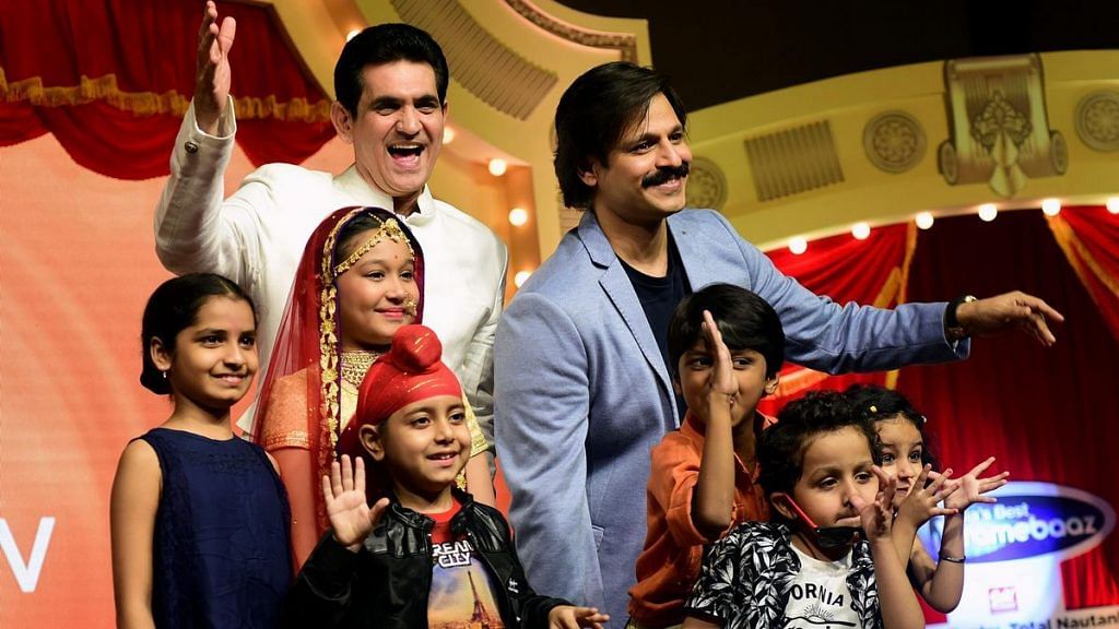 Actor Vivek Oberoi (R) at the launch of a Zee TV children's show |Sujit Jaiswal/AFP/Getty Images