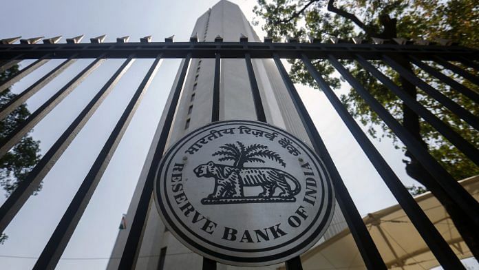The Reserve Bank of India (RBI) logo is displayed on a gate at the central bank's headquarters in Mumbai, India