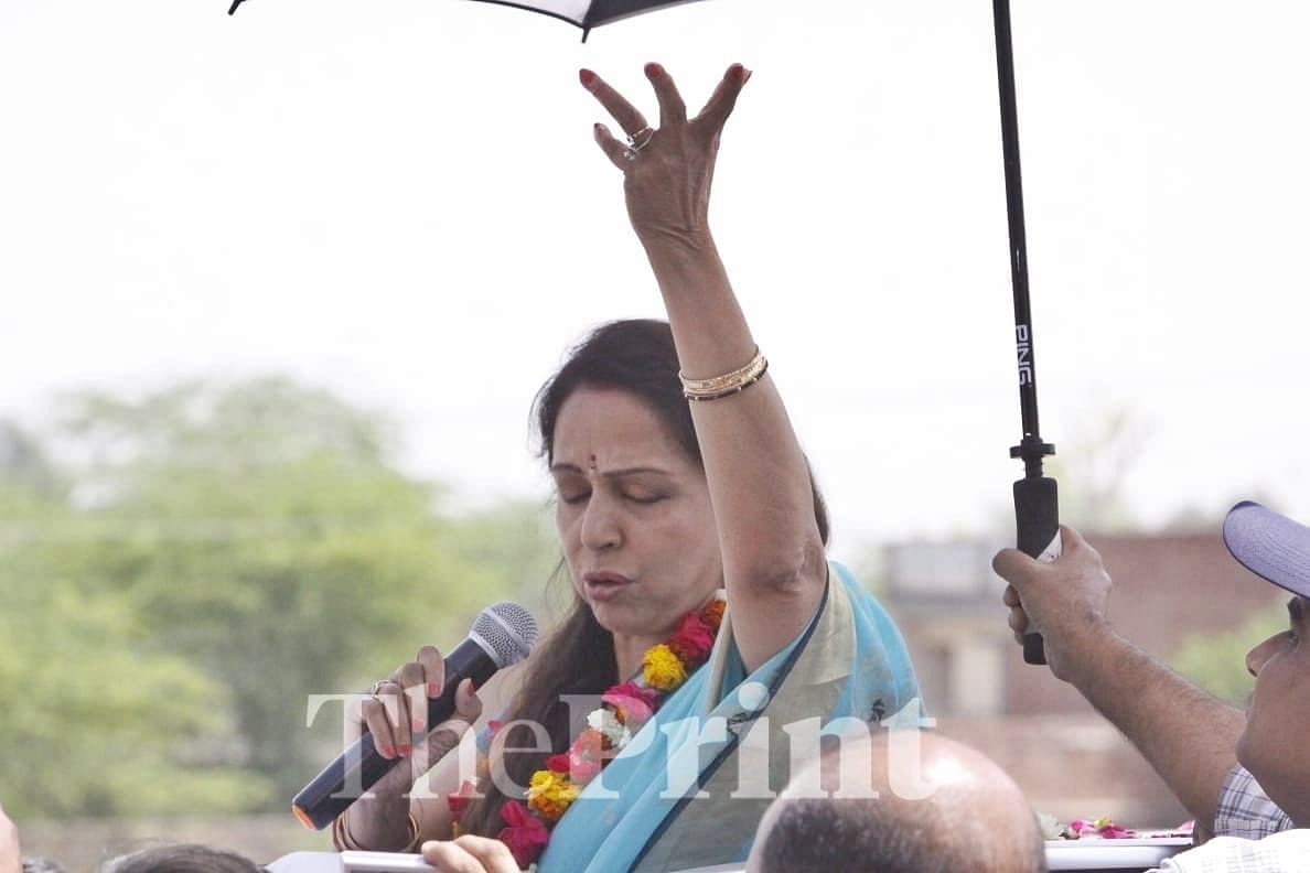 Malini emerges from the sun-roof when vehicle stops in assorted villages | Praveen Jain / ThePrint