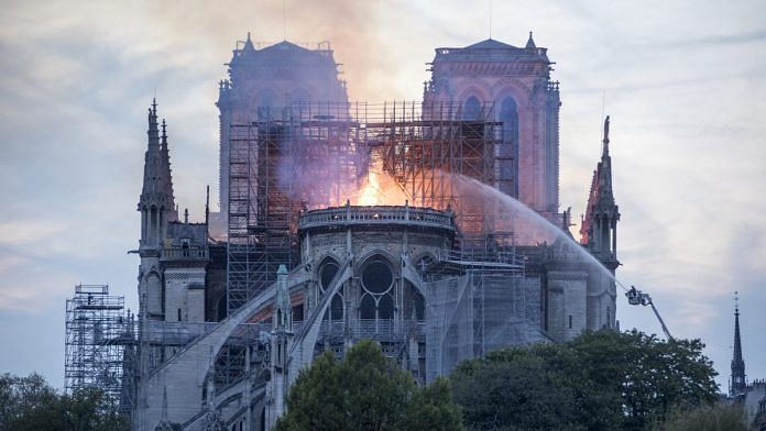 Flames and smoke rise from a fire at Notre-Dame Cathedral in Paris, France