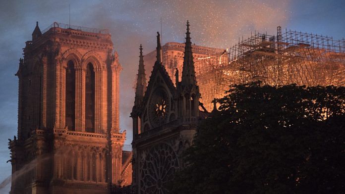 Flames and smoke rise from a fire at Notre-Dame Cathedral in Paris, France