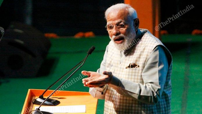 A close-up shot of PM Modi expressing while delivering a speech at the convention