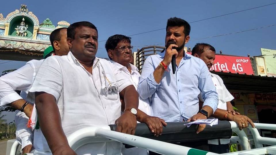 Prajwal Revanna (in blue) during an election campaign | Facebook