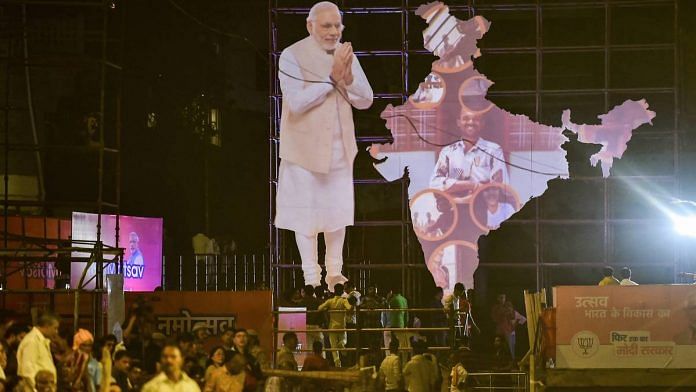 A cutout of PM Narendra Modi seen at Dashashwamedh Ghat on the eve of Prime Minister Narendra Modi's election rally in Varanasi