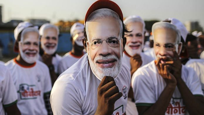 Supporters of PM Narendra Modi wear his masks, Mumbai | Dhiraj Singh | Bloomberg