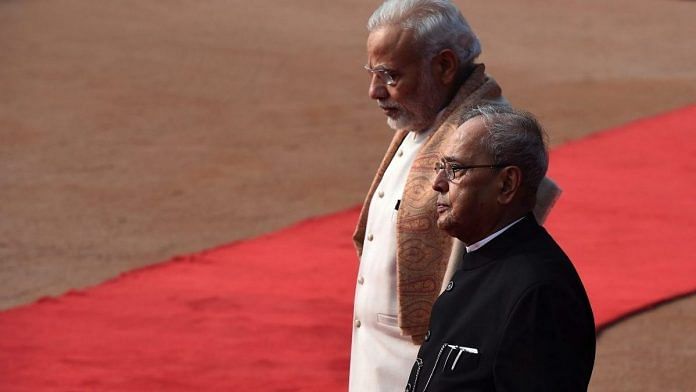 File photo| Former President Pranab Mukherjee (R) with Prime Minister Narendra Modi (L) | Prakash Singh/Getty Images