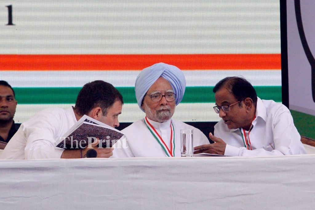 Congress president Rahul Gandhi (L) shares a word with former PM Manmohan Singh (M) as former finance minister P. Chidambaram listens | Praveen Jain/ThePrint