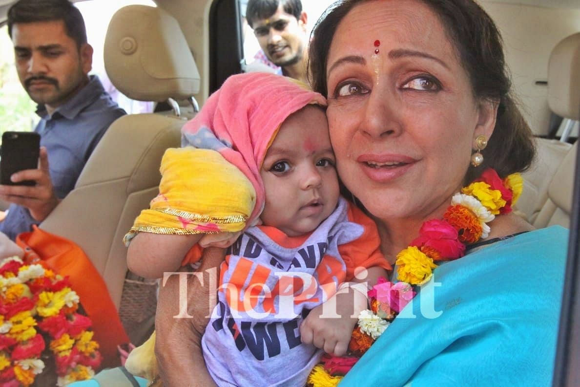 Hema Malini holds a villagers baby | Praveen Jain/ ThePrint