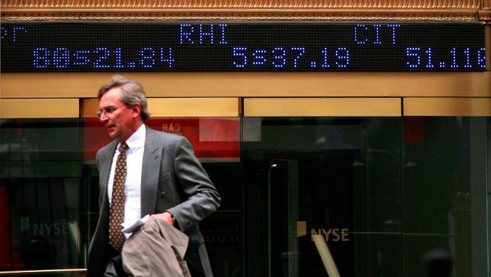 A man leaves the New York Stock Exchange in New York, Wednesday