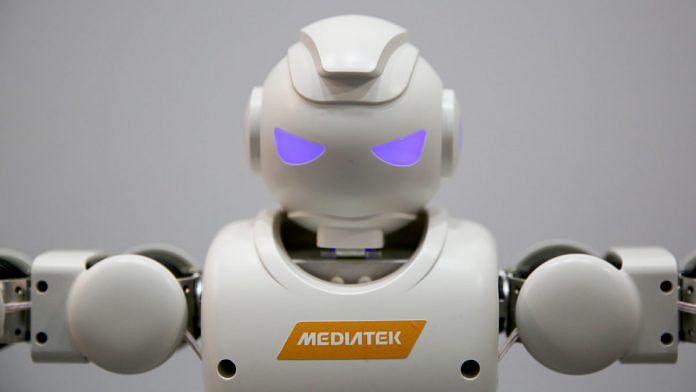 A robot stands on display on the MediaTek Inc. stand