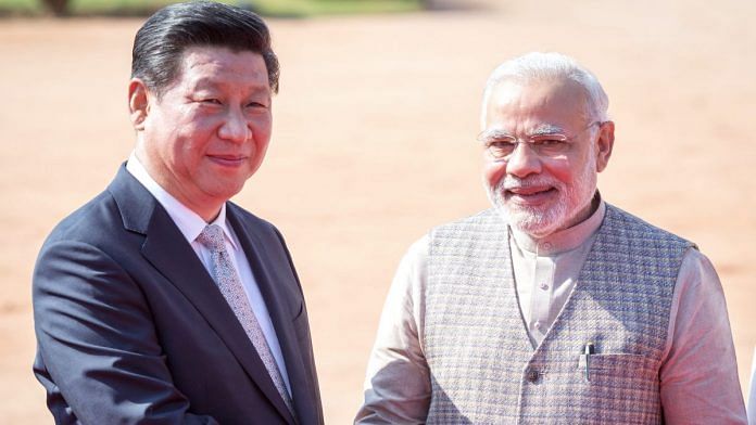 File photo | Narendra Modi with China president Xi Jinping in New Delhi | Graham Crouch | Bloomberg
