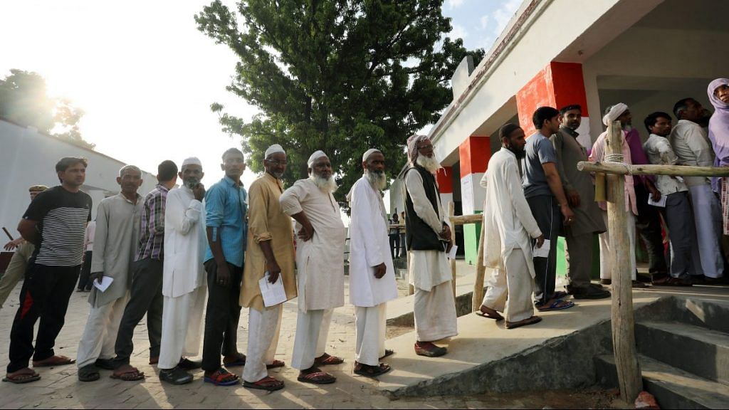 Voters wait in line at a polling station in Muzaffarnagar, Uttar Pradesh | T. Narayan | Bloomberg
