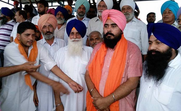Former Punjab AAP MLA Amarjeet Singh Sandoa (in orange) who joined the Congress on Saturday | Facebook