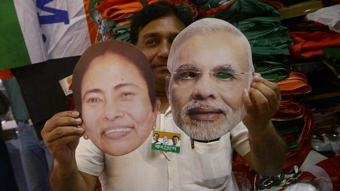 Face masks of Mamata Banerjee and PM Modi