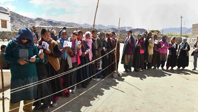 Voters stand in a queue at a polling station during the fifth phase of Lok Sabha polls, at Shey village in Leh, Monday, May 6, 2019